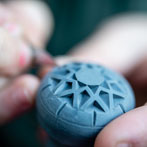 Amberlea McNaught carving a small pot for Celebrating Ceramics’ Make Mine Miniature competition